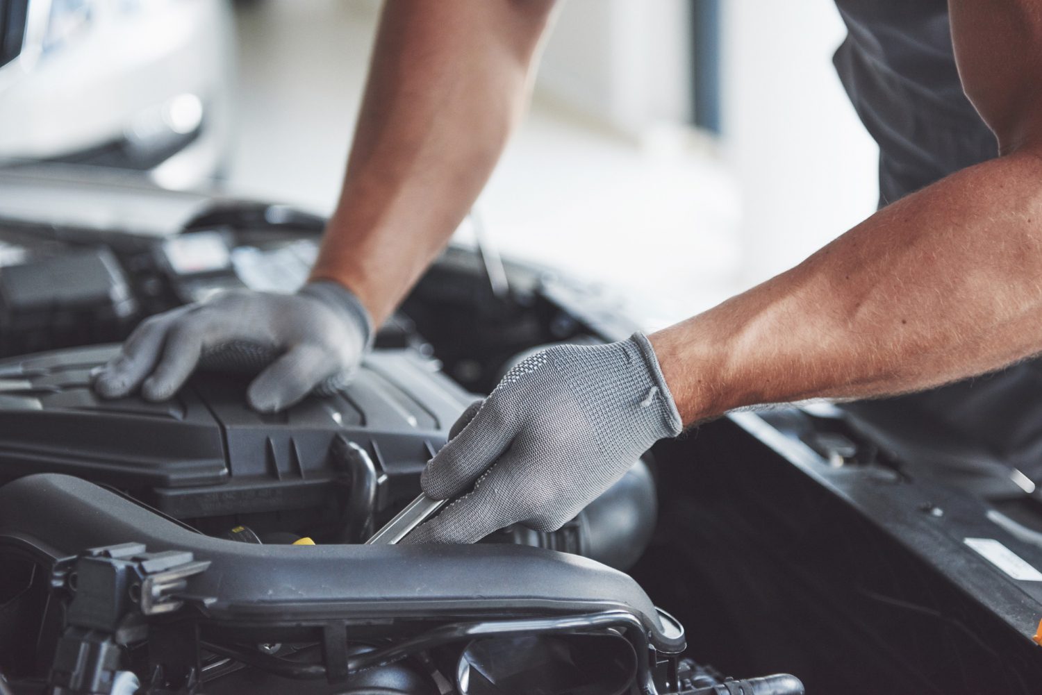 auto-mechanic-working-garage-repair-service auto-mechanic-working-garage-repair-service